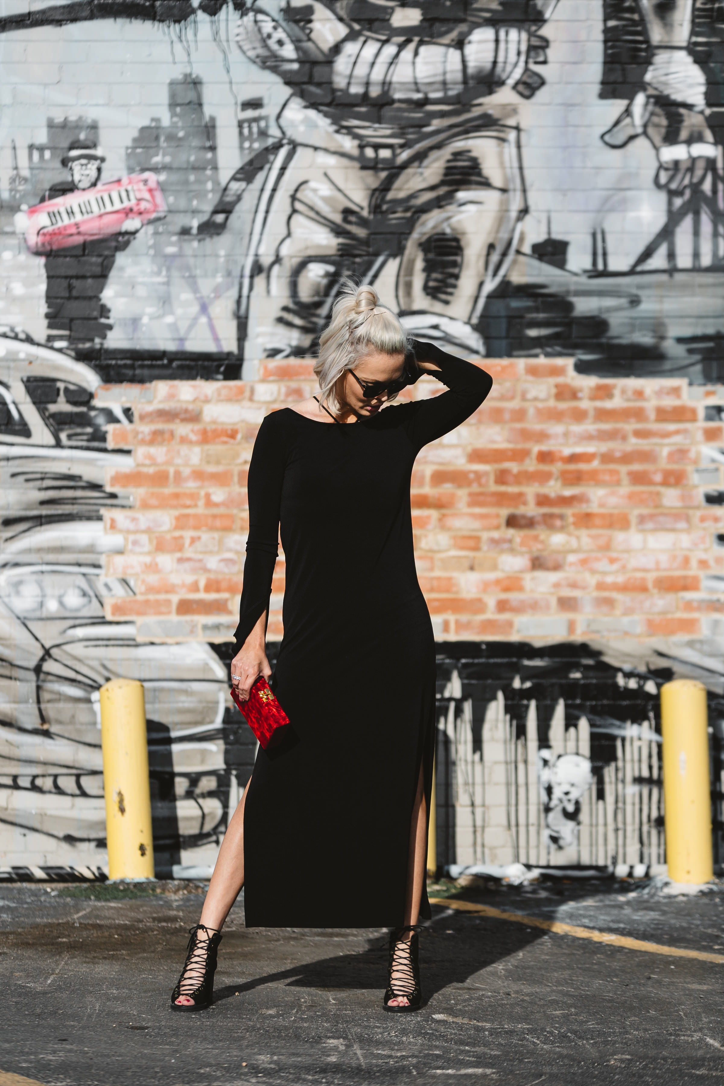 little black dress with red clutch