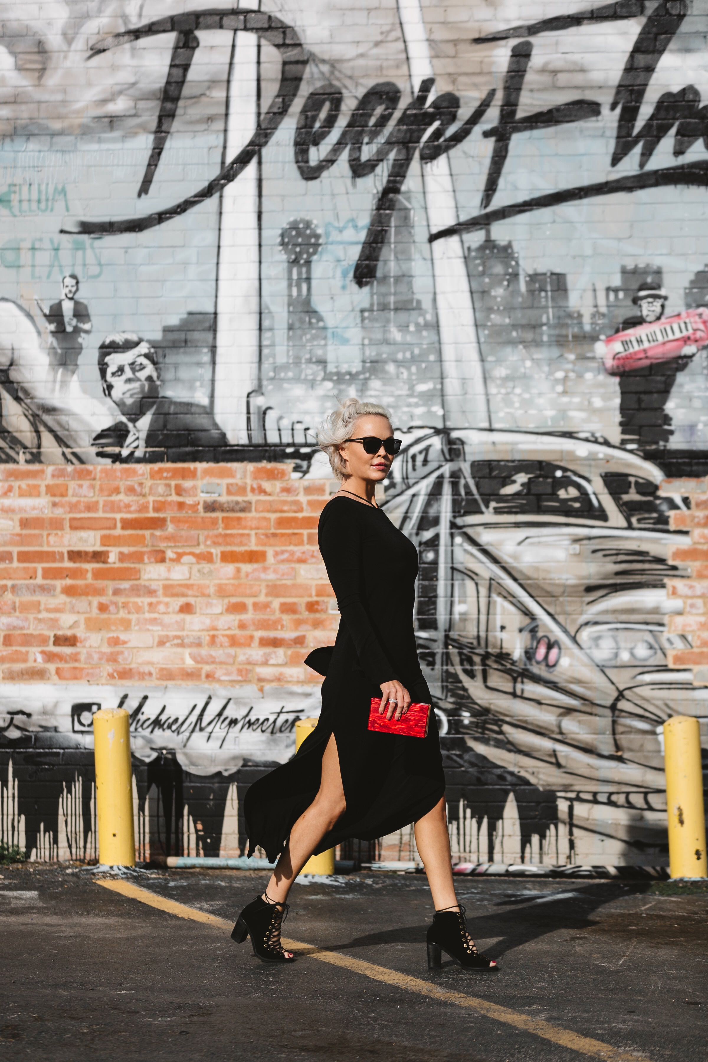  little black dress paired with a red clutch