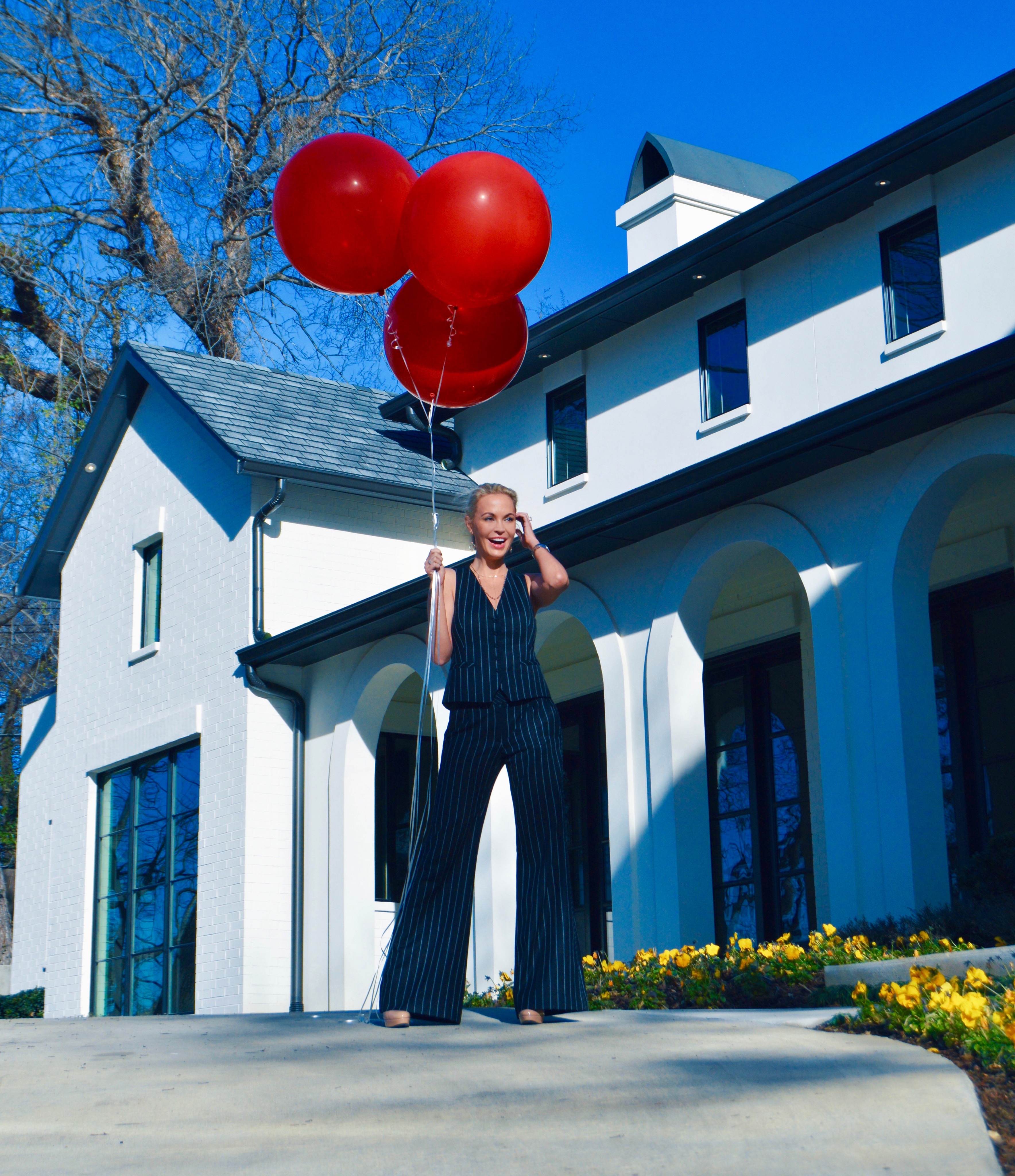 pinstripe suite and red balloons - staying positive as habits of successful people