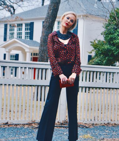 red heart shirt with black pants