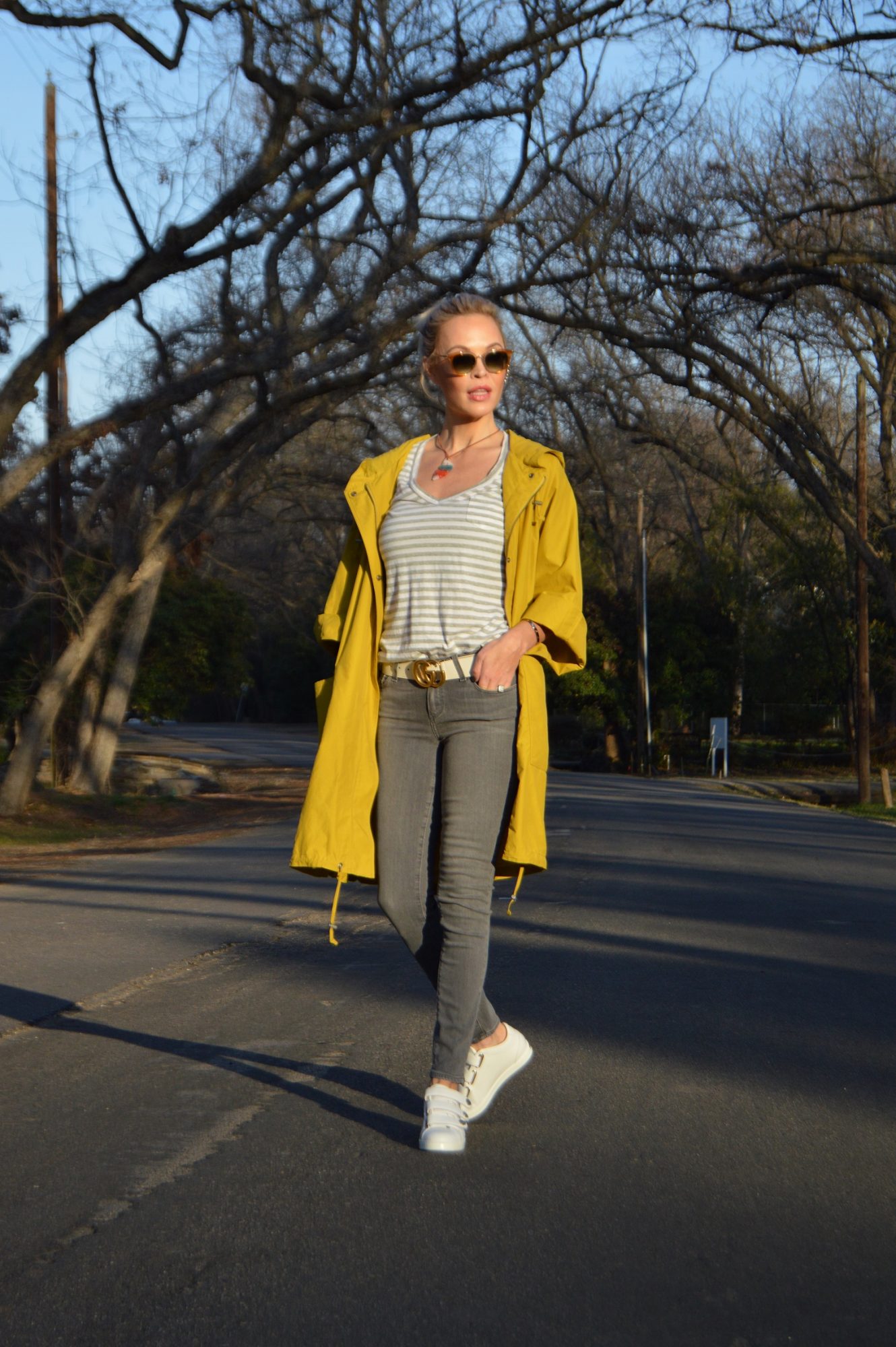 yellow raincoat and grey pants featured in voyage dallas