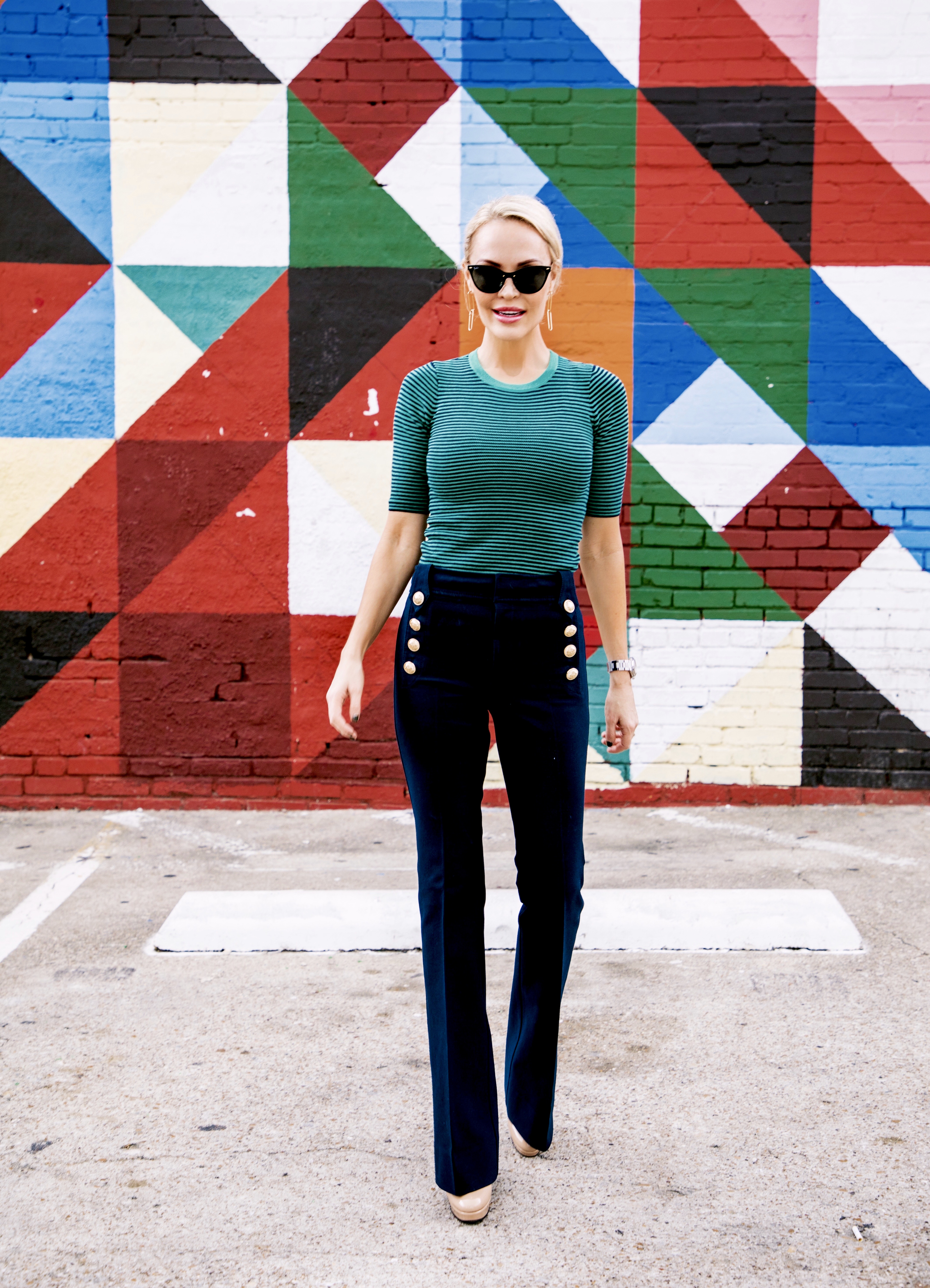 clothing color psychology is shown off in the geometric, colorful wall