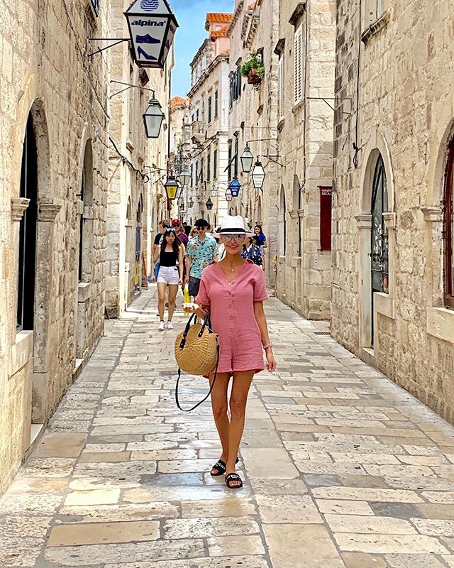 wearing a pink romper on the streets of Croatia