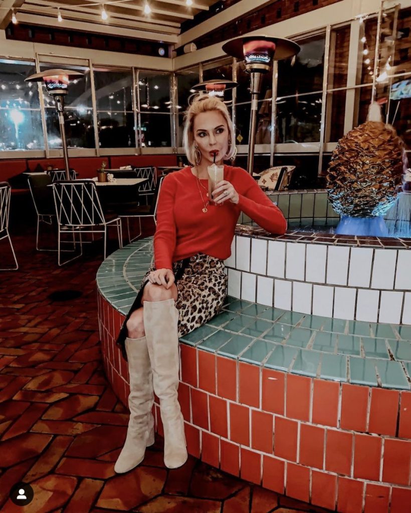 red sweater and animal print skirt