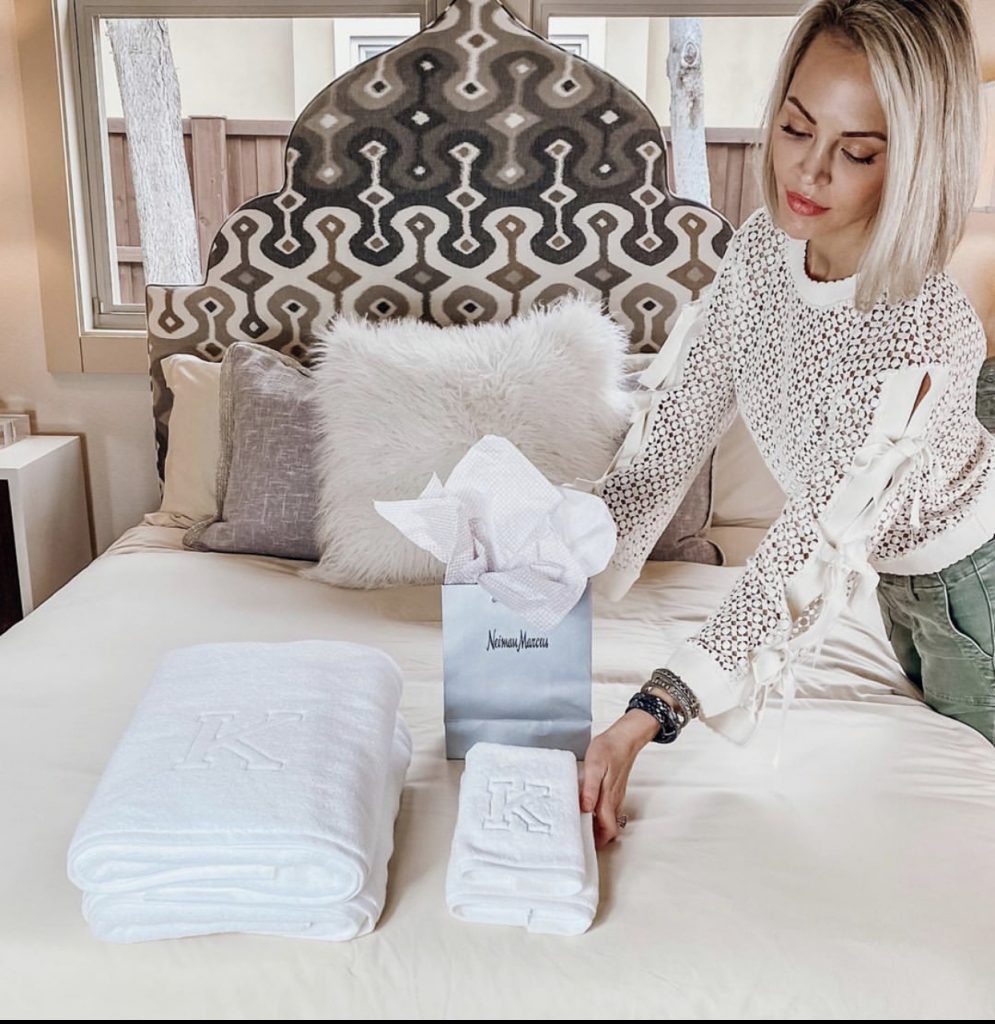 monogrammed towels on a beautiful bed