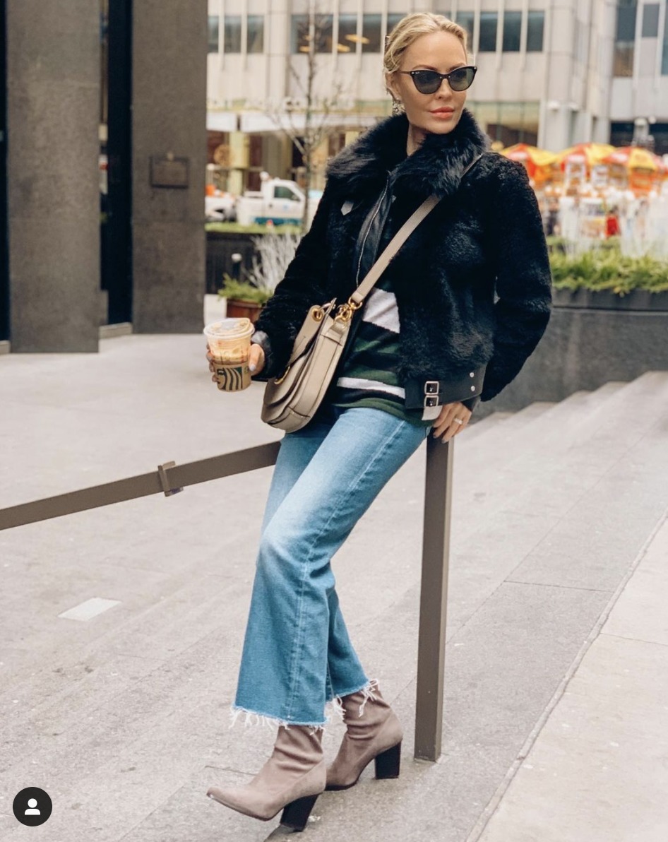 bootcut jeans with booties and a faux fur jacket