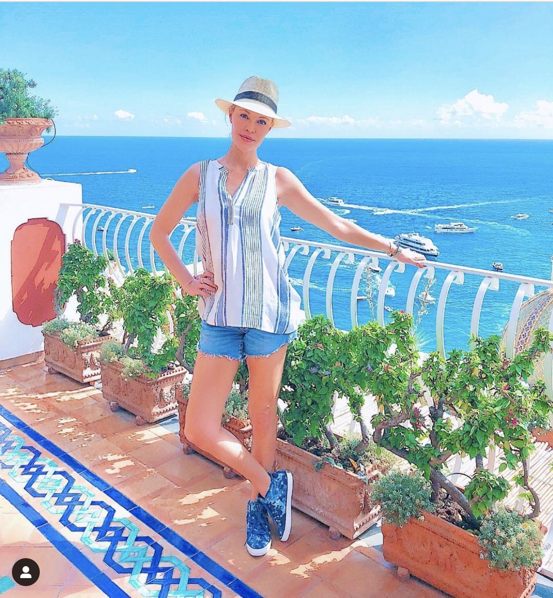 summer outfit with hair up and a straw hat